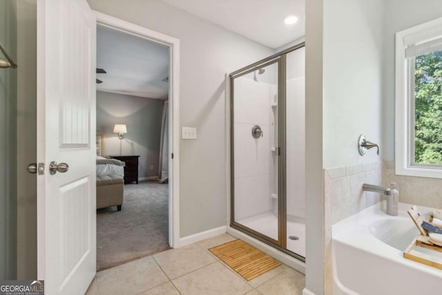 bathroom featuring tile patterned floors and shower with separate bathtub