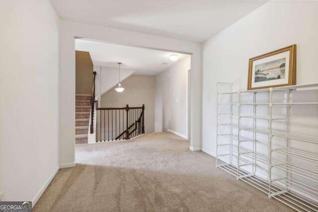 hallway with carpet