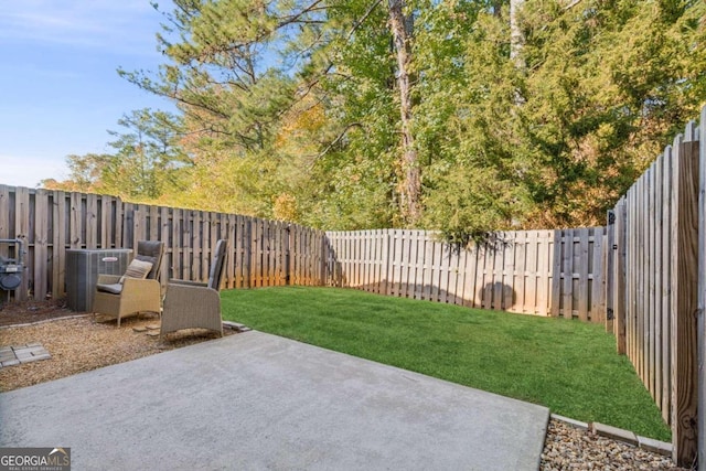 view of yard featuring a patio and central AC unit