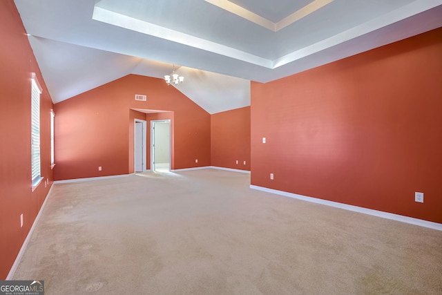 bonus room featuring light carpet, a notable chandelier, and lofted ceiling