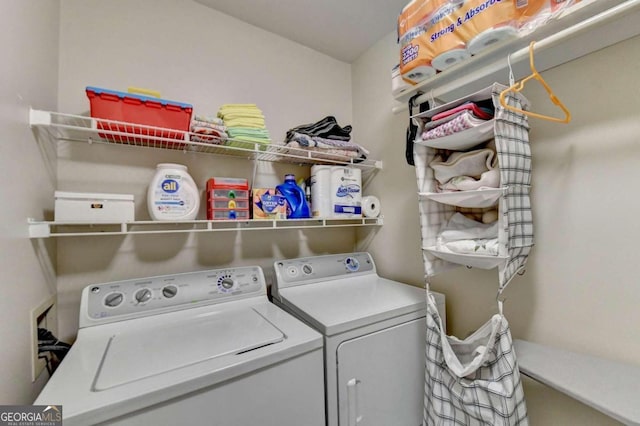 washroom featuring washing machine and dryer