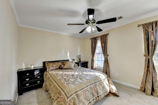 carpeted bedroom with ornamental molding and ceiling fan