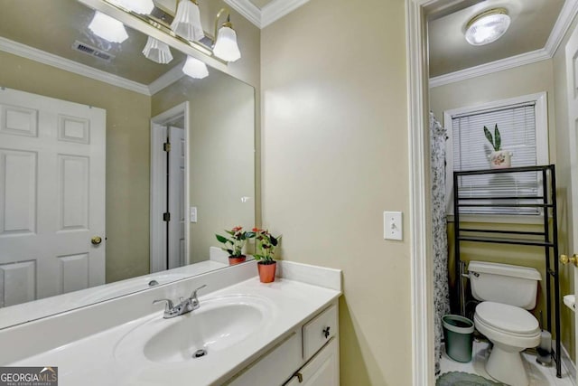 bathroom featuring vanity, toilet, and crown molding