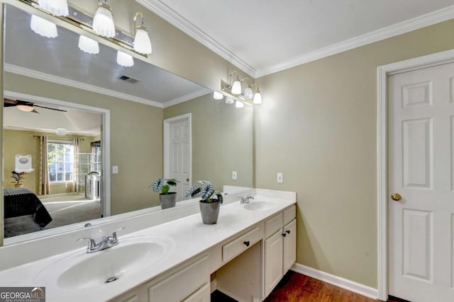 bathroom featuring vanity, crown molding, hardwood / wood-style flooring, and ceiling fan