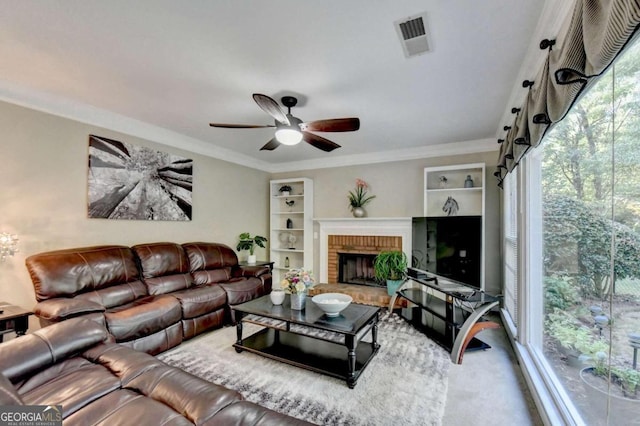 living room with ceiling fan, ornamental molding, and a fireplace