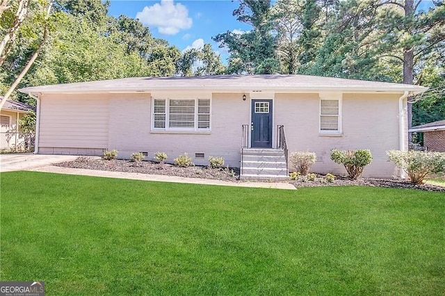 ranch-style home with a front lawn