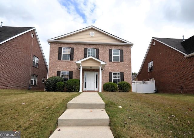 view of front of home featuring a front yard