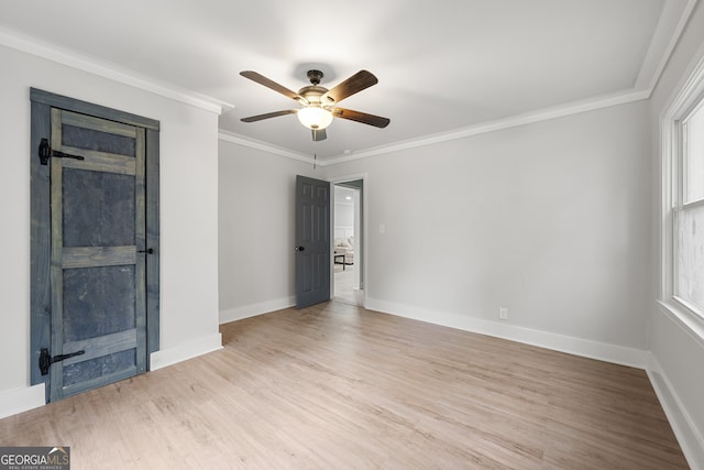 spare room with ceiling fan, light hardwood / wood-style flooring, and ornamental molding