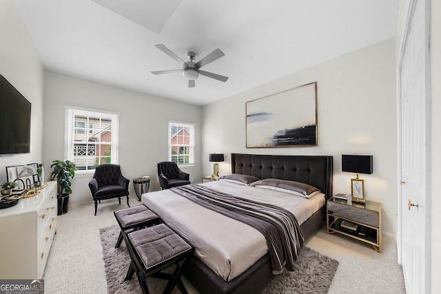 carpeted bedroom featuring ceiling fan