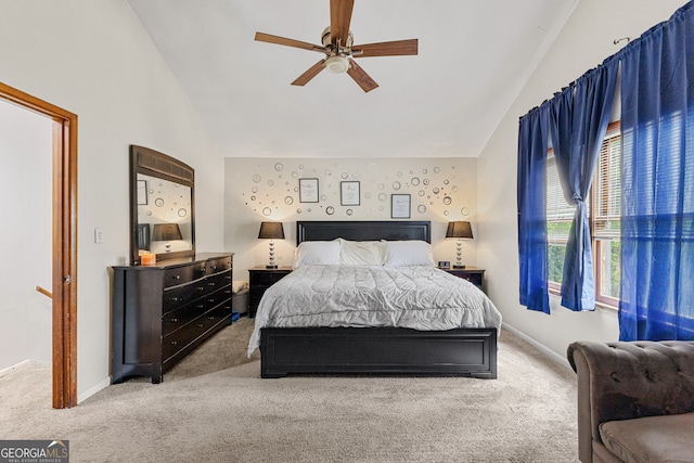 carpeted bedroom with lofted ceiling and ceiling fan