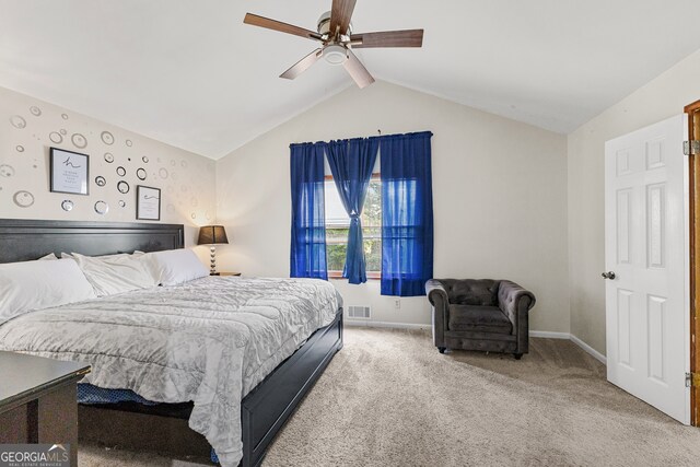 carpeted bedroom featuring vaulted ceiling and ceiling fan