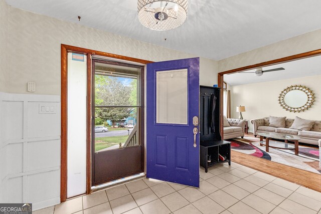 entrance foyer with an inviting chandelier and light hardwood / wood-style flooring