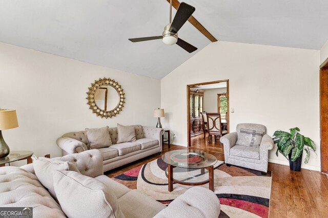 living room featuring ceiling fan, hardwood / wood-style flooring, and lofted ceiling