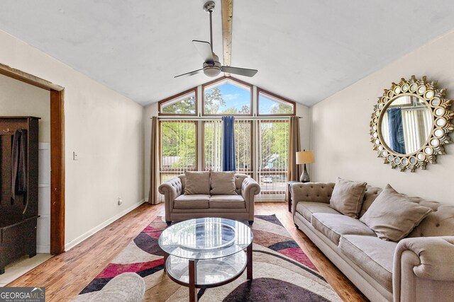 living room featuring lofted ceiling, light hardwood / wood-style flooring, and ceiling fan