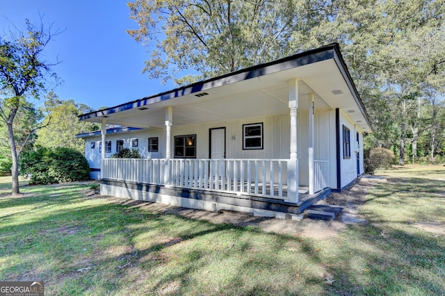 view of front of house featuring a front yard and a porch