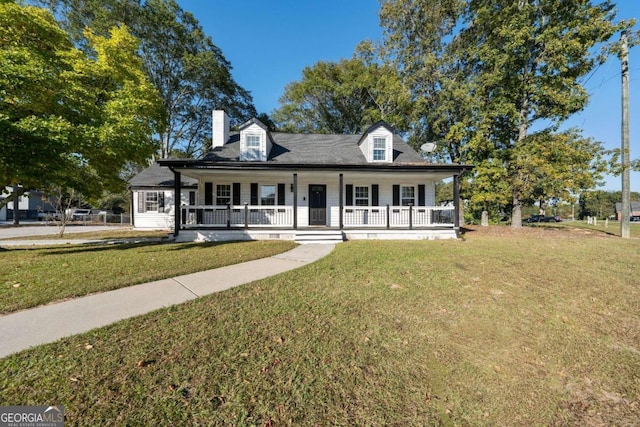 view of front of home with a porch and a front lawn