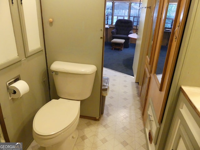 bathroom with toilet and vanity