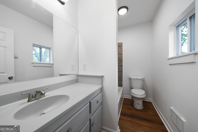 382 N Fifth St, Cedartown, GA 30125 - full bathroom with wood finished floors, toilet, vanity, and baseboards
