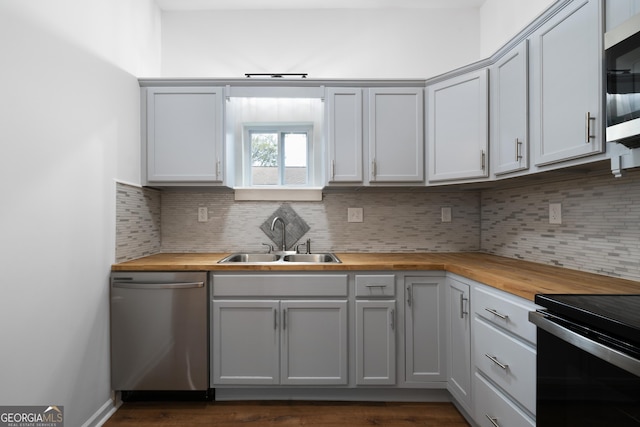382 N Fifth St, Cedartown, GA 30125 - kitchen featuring wood counters, stainless steel appliances, a sink, and backsplash