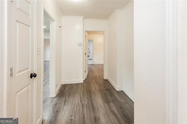 hall featuring crown molding and hardwood / wood-style flooring