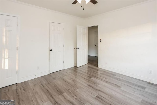 unfurnished bedroom with ornamental molding, light hardwood / wood-style flooring, and ceiling fan