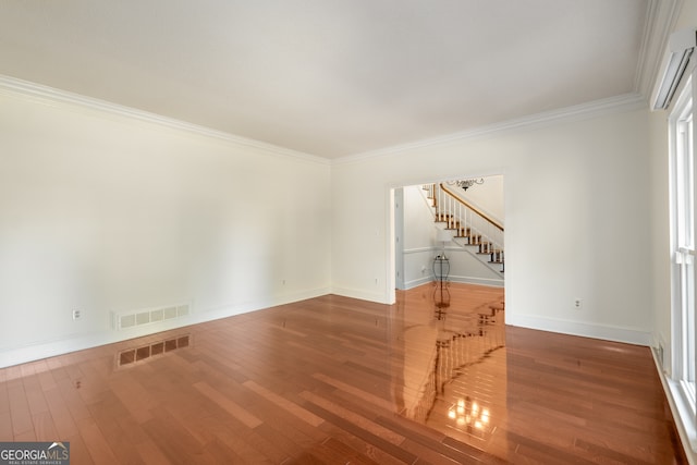 unfurnished room with hardwood / wood-style flooring and crown molding