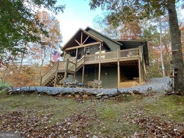 289 Cypress Cir, Ellijay, GA 30540 - back of property with stairway and a deck