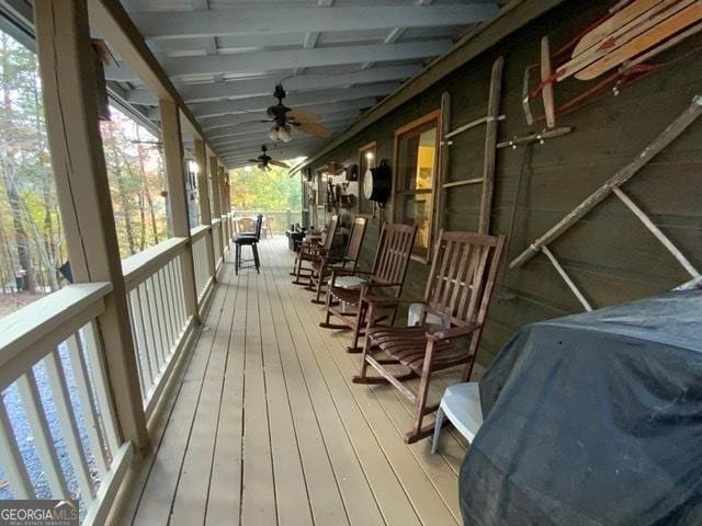 wooden terrace with ceiling fan