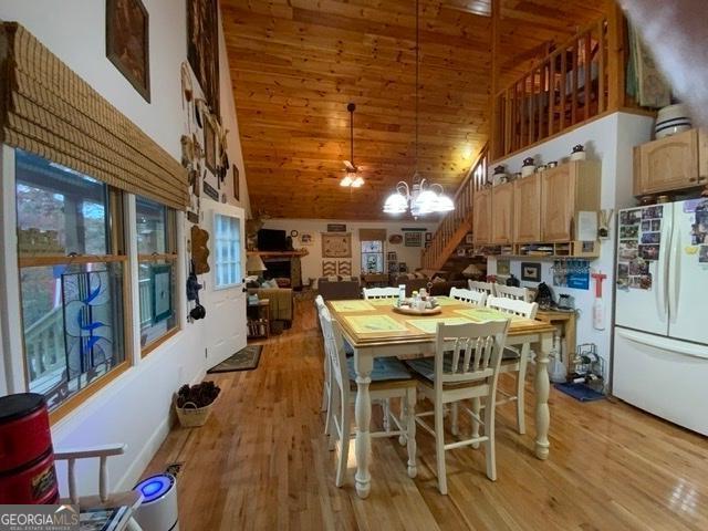 289 Cypress Cir, Ellijay, GA 30540 - kitchen with freestanding refrigerator, light wood-style floors, open floor plan, high vaulted ceiling, and wood ceiling