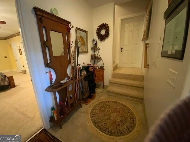 hallway with light colored carpet