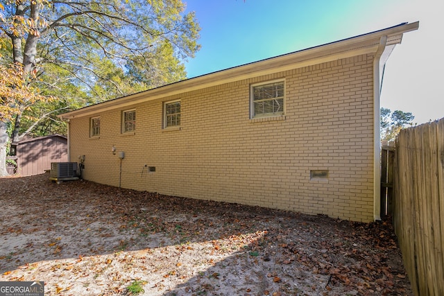 view of side of property with central AC unit