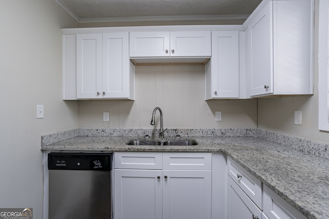 kitchen featuring sink, a textured ceiling, white cabinetry, stainless steel dishwasher, and ornamental molding