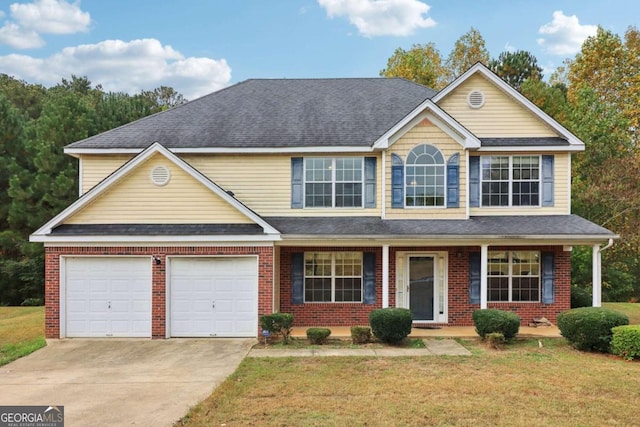 view of front of property featuring a front lawn and covered porch