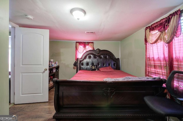 bedroom featuring hardwood / wood-style flooring