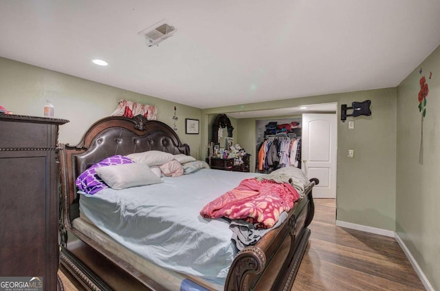 bedroom featuring a closet and wood-type flooring