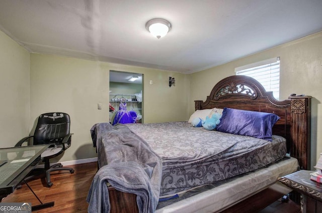 bedroom with dark wood-type flooring