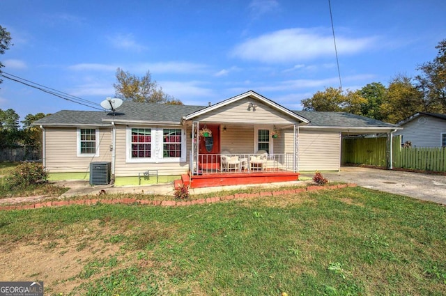 ranch-style house with cooling unit, a front yard, and a carport