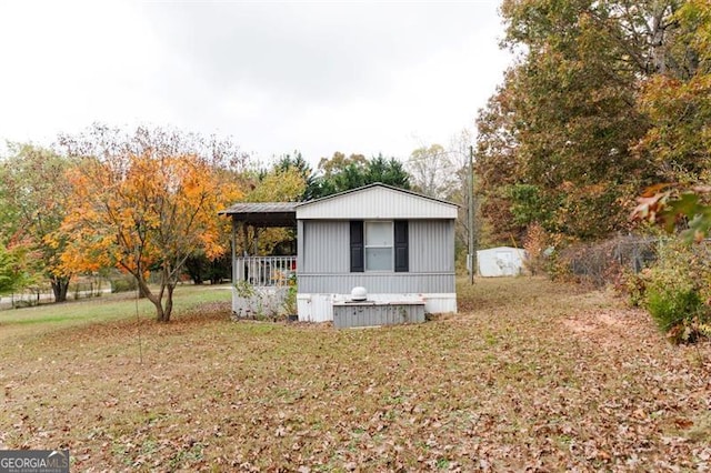 view of home's exterior with a lawn