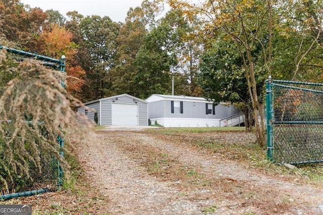 exterior space featuring an outdoor structure and a garage