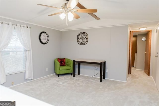 sitting room featuring light carpet, vaulted ceiling with beams, and ceiling fan