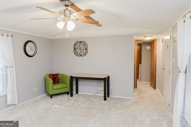 sitting room with light colored carpet and ceiling fan