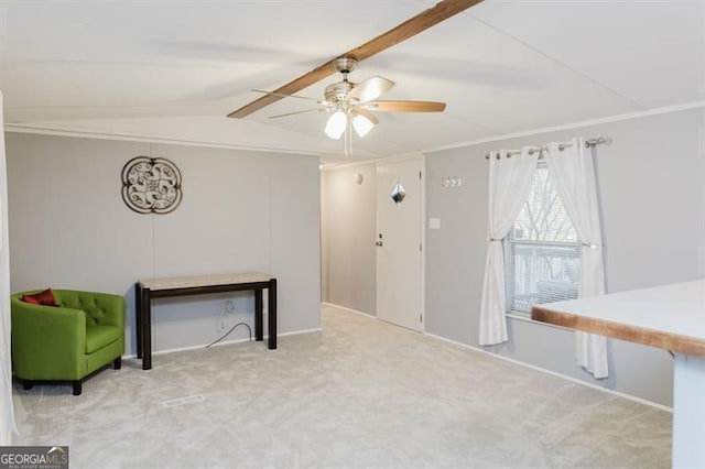 interior space with crown molding, carpet floors, lofted ceiling with beams, and ceiling fan