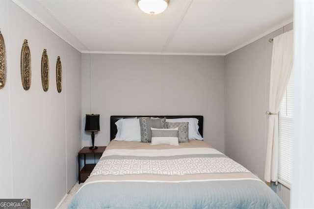 bedroom with ornamental molding