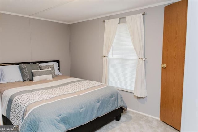 bedroom featuring light carpet and ornamental molding