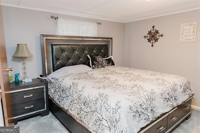 bedroom with light carpet and ornamental molding