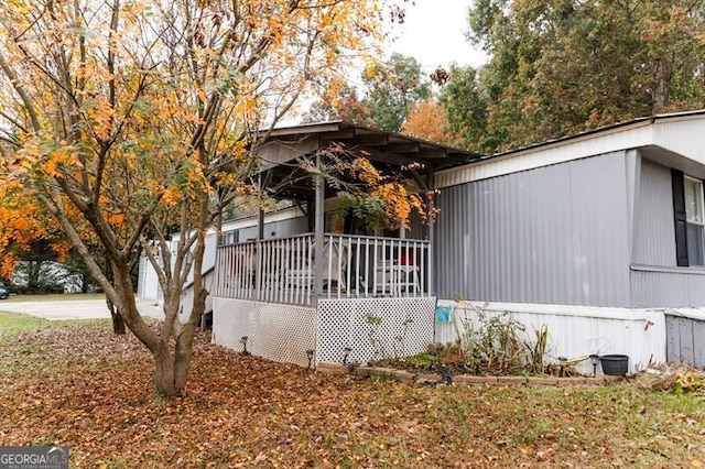 view of side of property with a deck