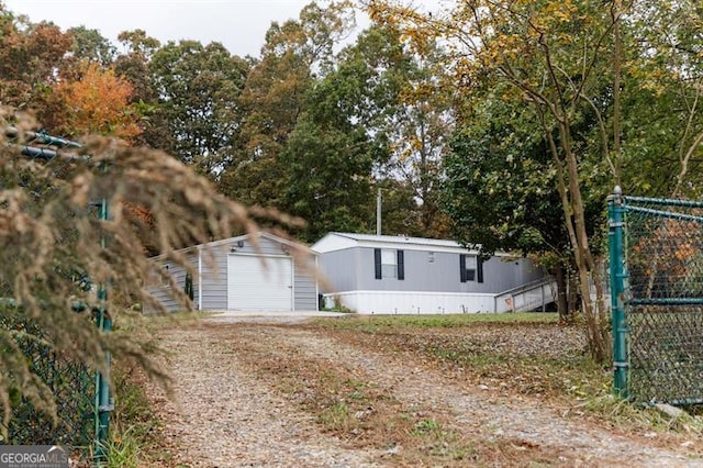 view of front of house with a storage shed