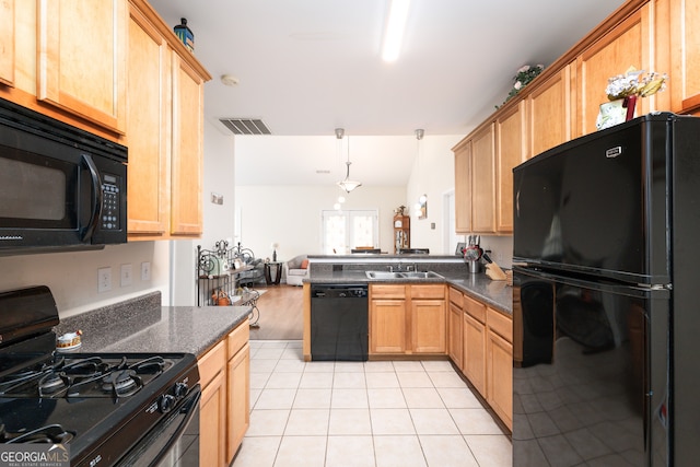 kitchen featuring black appliances, kitchen peninsula, hanging light fixtures, lofted ceiling, and light tile patterned floors