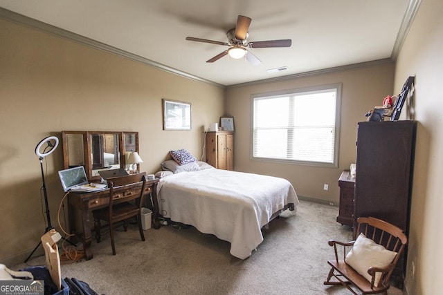 bedroom with ceiling fan, light carpet, and ornamental molding