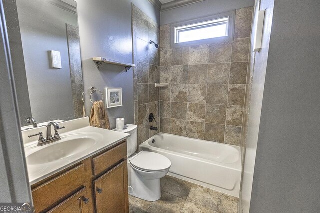 bathroom with bathtub / shower combination, vanity, and toilet